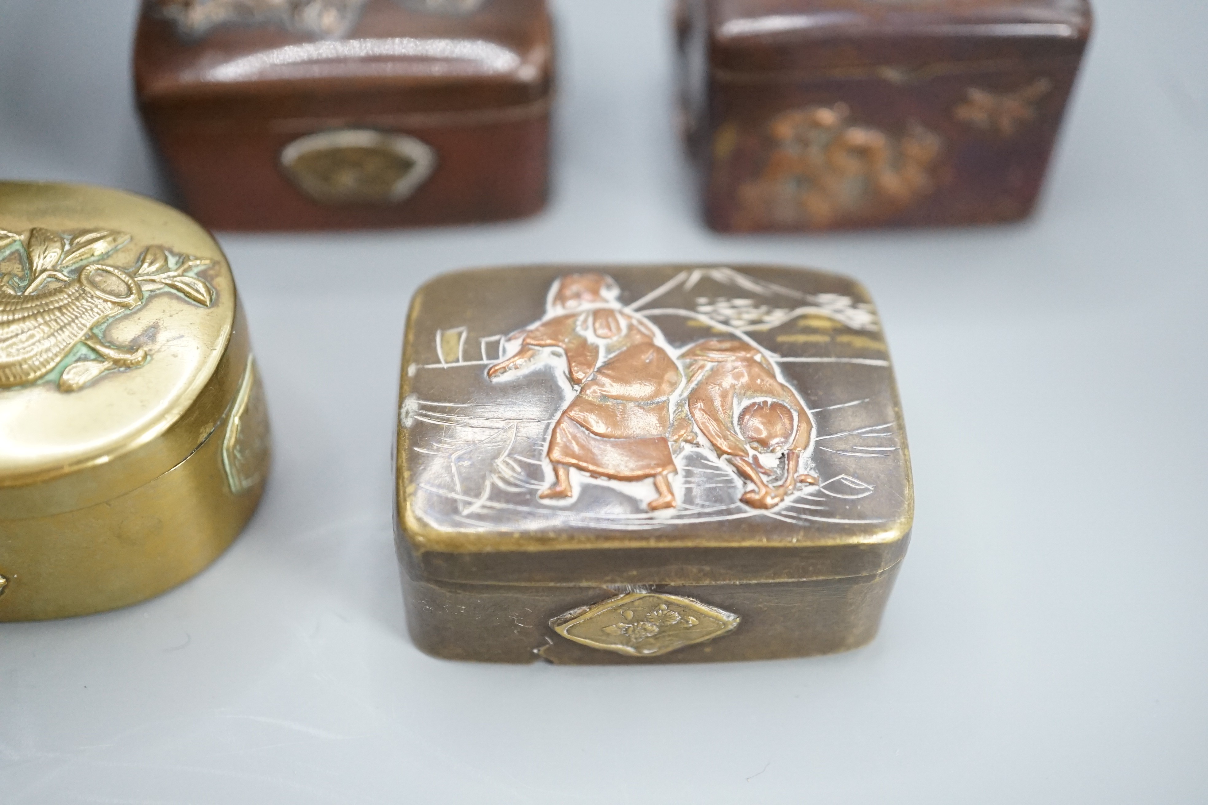 A Japanese cloisonne enamel koro and cover, 9.5 cm diameter and various Japanese mixed metal small boxes and covers, One made from Japanese sword fittings, signed, 4 cm